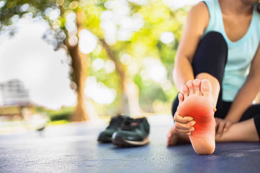 Girl with foot pain in need of a chiropractic foot specialist, do custom orthotics work