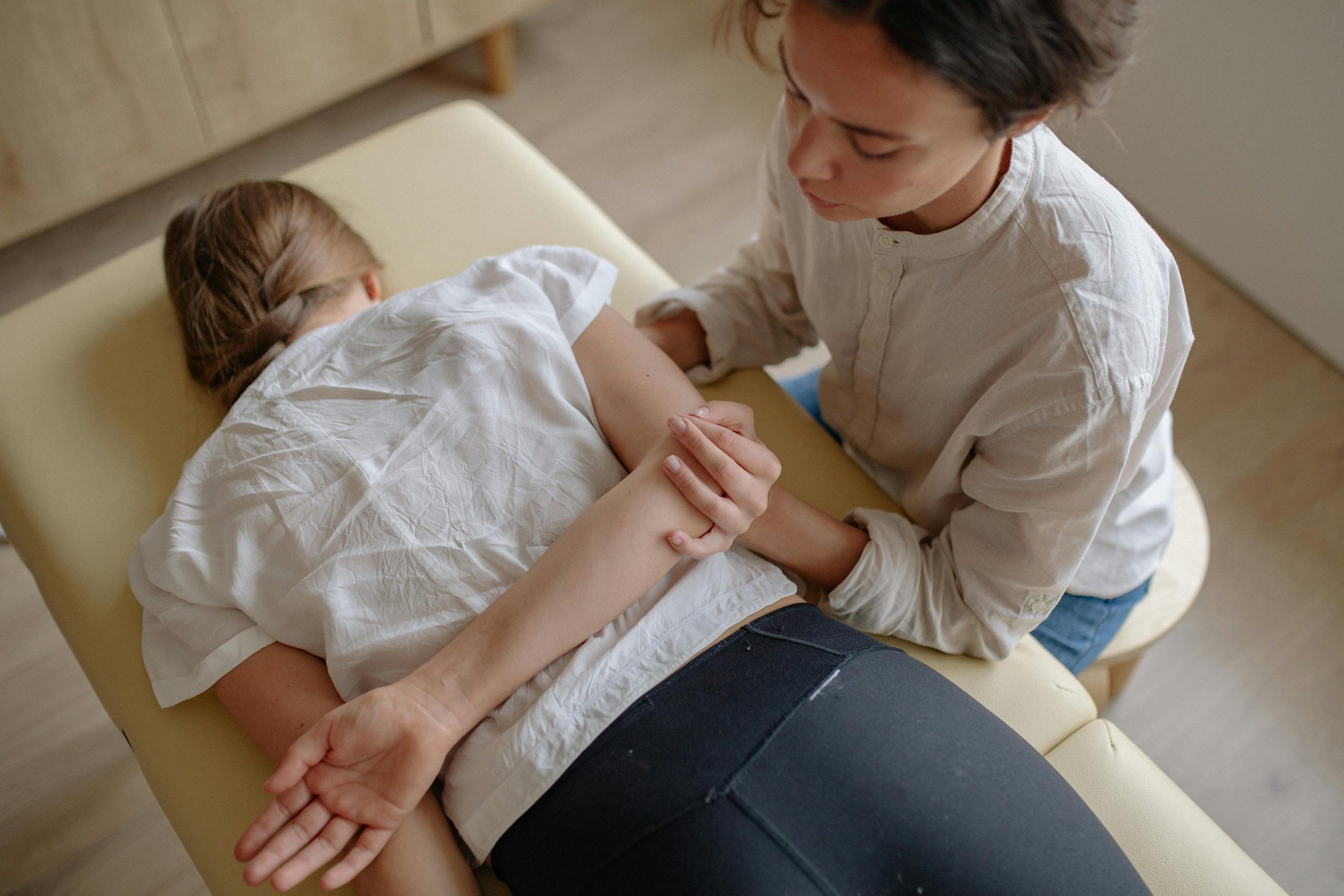 chiropractor performing spinal manipulation, postural imbalances treatment