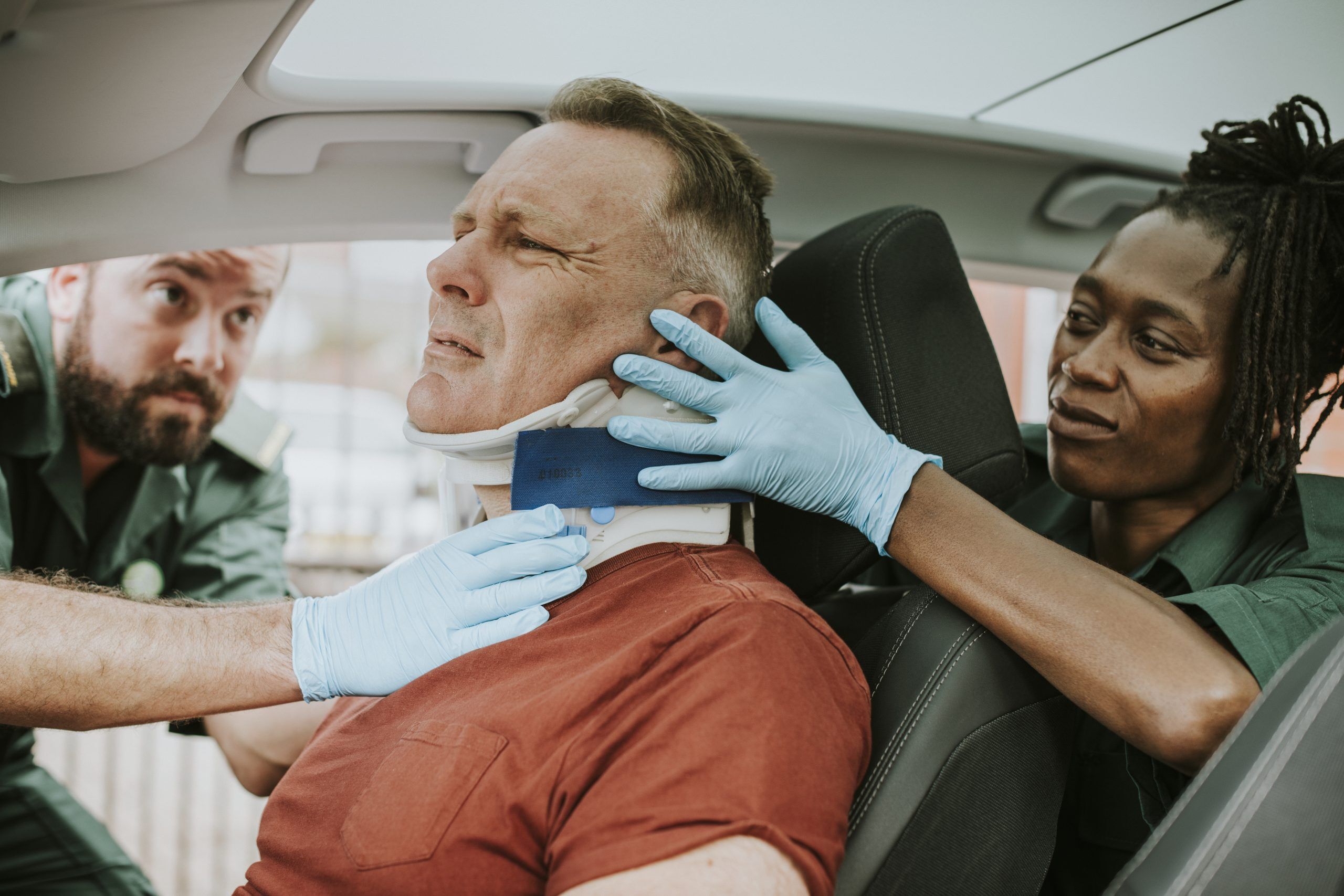 A man experiencing pain from car accident